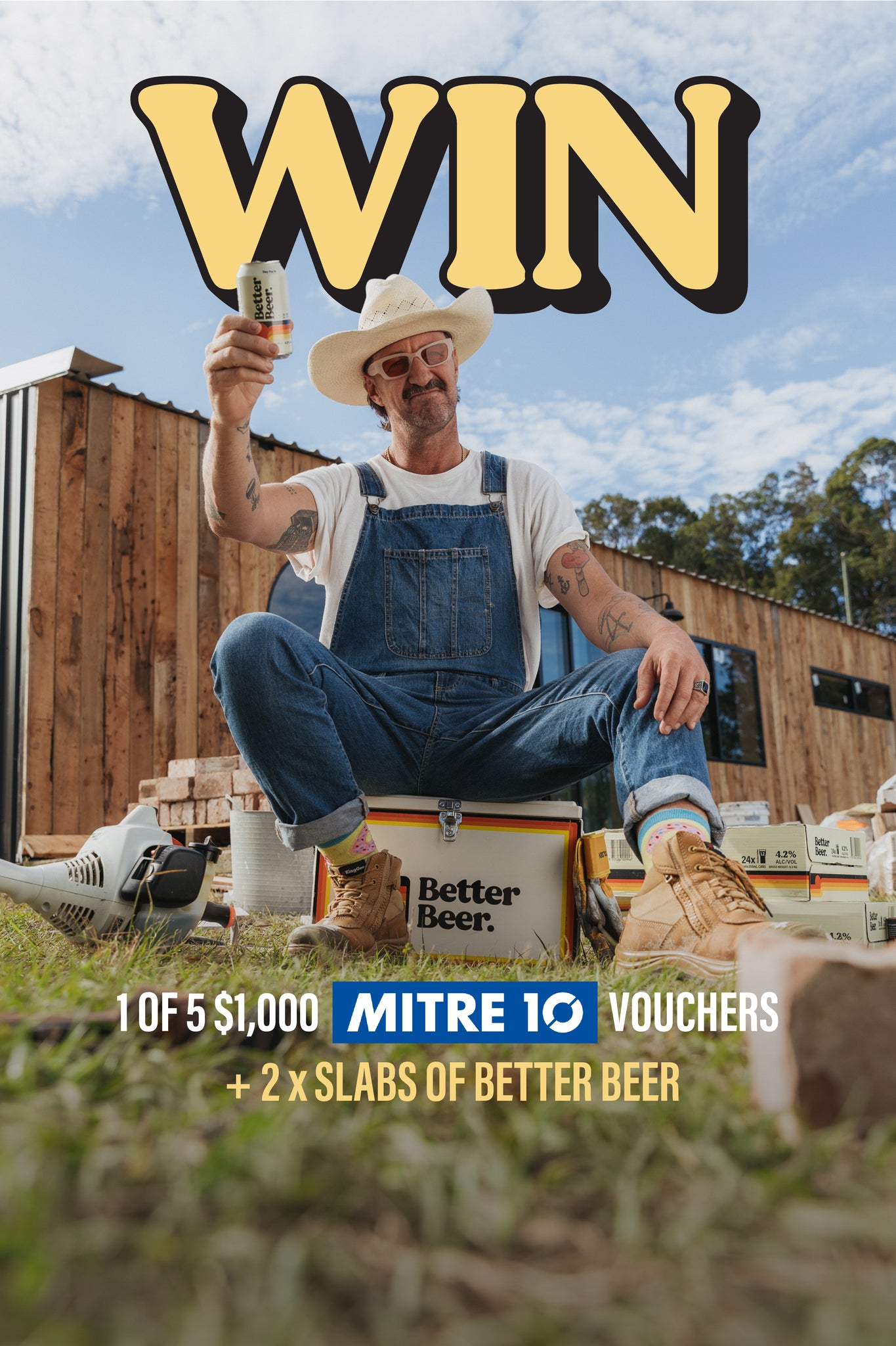 Man in overalls holding a beer with promotional text for Mitre 10 vouchers and Better Beer.