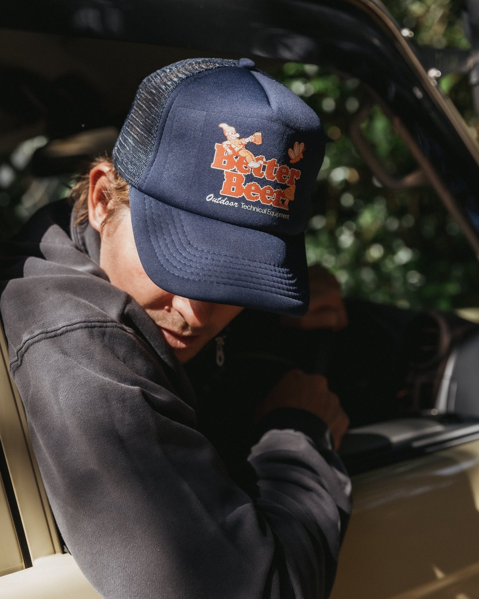 Pixelated Gnome Navy Trucker Cap front lifestyle | Better Beer